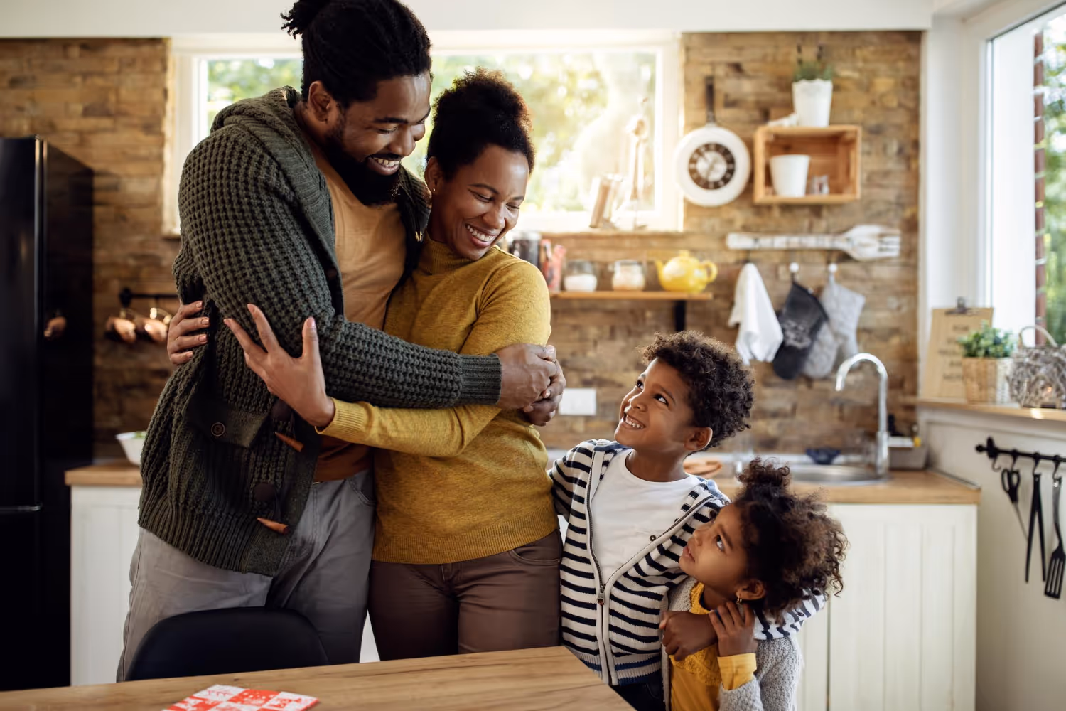 A happy family in their kitchen after mold remediation